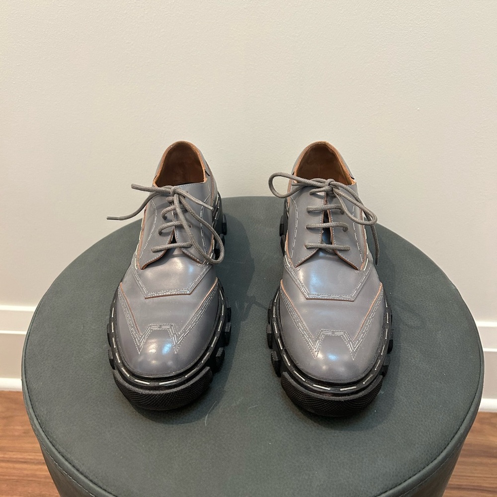 BALENCIAGA: New Blue Gray Leather
Staple Trim Derby Shoes